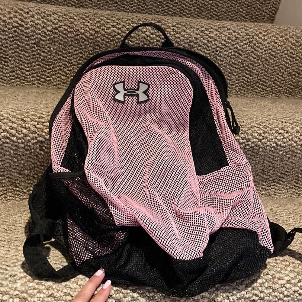 Under armor breathable back pack with a attached cover for rain.
